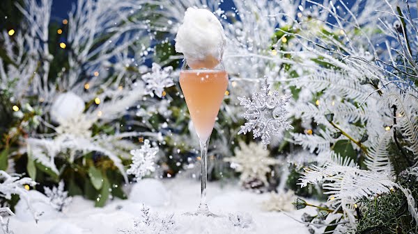 winter cocktail photographed against a snowy backdrop