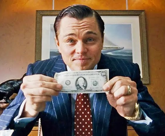 5c7f6b8c2628985ca8263983 man holding American dollar bill