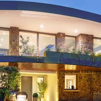 This home’s unique curved overhang balcony boasts stunning views across Killiney Bay