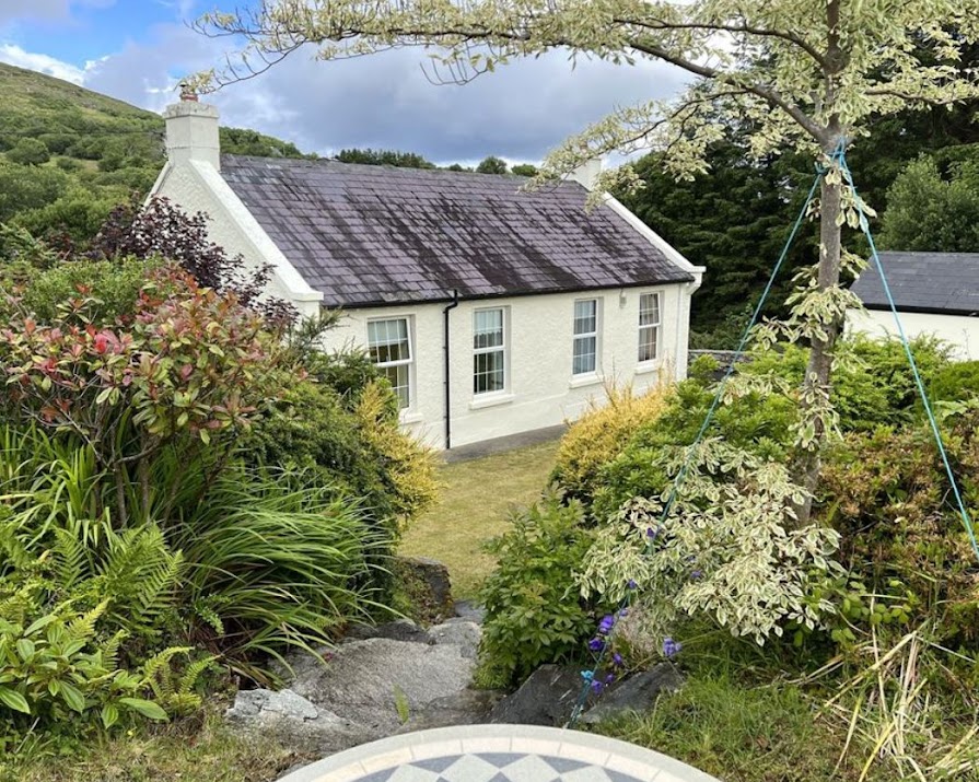 This cute country cottage with idyllic grounds filled with flowers is now on the market for €220,000