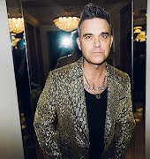 Robbie Williams says he was once targeted by a hitman at the height of his fame