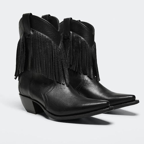 Fringed Leather boots, €299.99, Mango