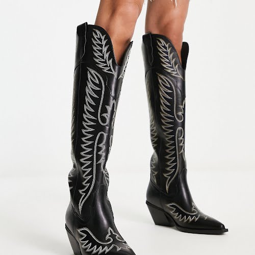 ASOS Design Chester Contrast Stitch Western Knee Boot in Black, €76.99, ASOS