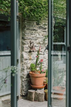 As the farmhouse dates back almost to famine times, you can see layers of stone work from different eras throughout. Photography by Shantanu Starick, Styling by Ciara