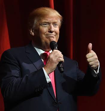 LAS VEGAS, NV - JANUARY 21: Republican presidential candidate Donald Trump gives a thumbs-up as he speaks during the Outdoor Channel and Sportsman Channel's 16th annual Outdoor Sportsman Awards at The Venetian Las Vegas during the 2016 National Shooting Sports Foundation's Shooting, Hunting, Outdoor Trade (SHOT) Show on January 21, 2016 in Las Vegas, Nevada. The SHOT Show, the world's largest annual trade show for shooting, hunting and law enforcement professionals, runs through January 23 and features 1,600 exhibitors showing off their latest products and services to more than 62,000 attendees. (Photo by Ethan Miller/Getty Images)