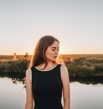 woman looking wistfully into the distance