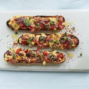 Supper Club: Tomato toast with scrambled eggs, herbs and olives