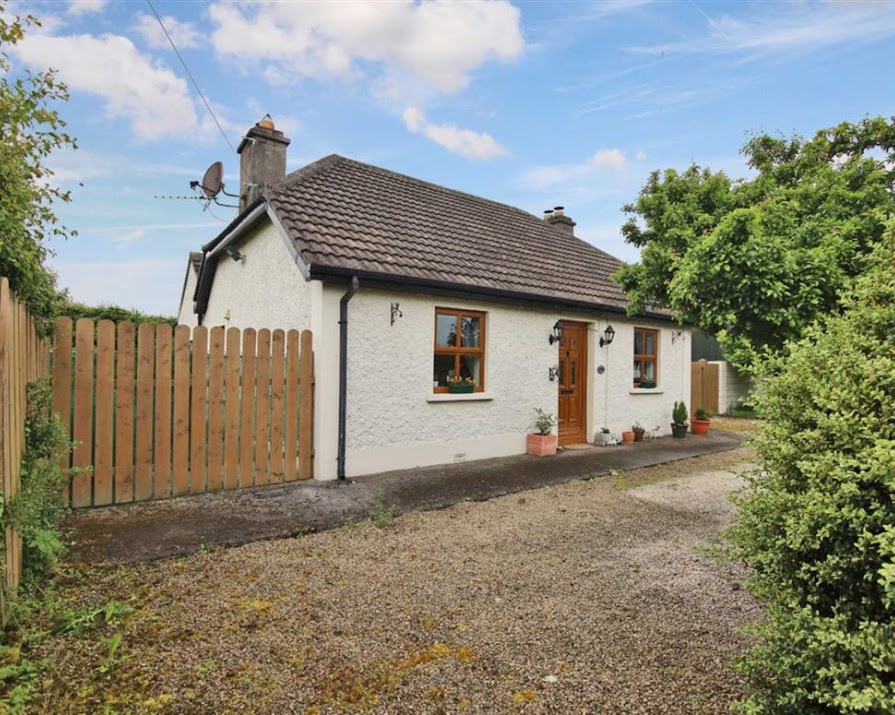 This sweet country cottage with a picket fence and private garden is on the market for €310,000