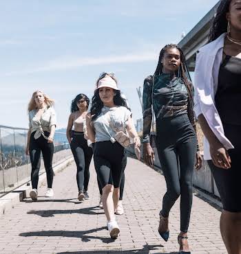 group of women walking together on a sunny day