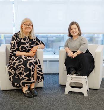 Niamh Donnelly, left, and Sinéad Burke, right, sit side by side at a recent Eversheds Sutherlands event.
