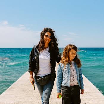Mom and daughter walking by the sea in Istria, Croatia